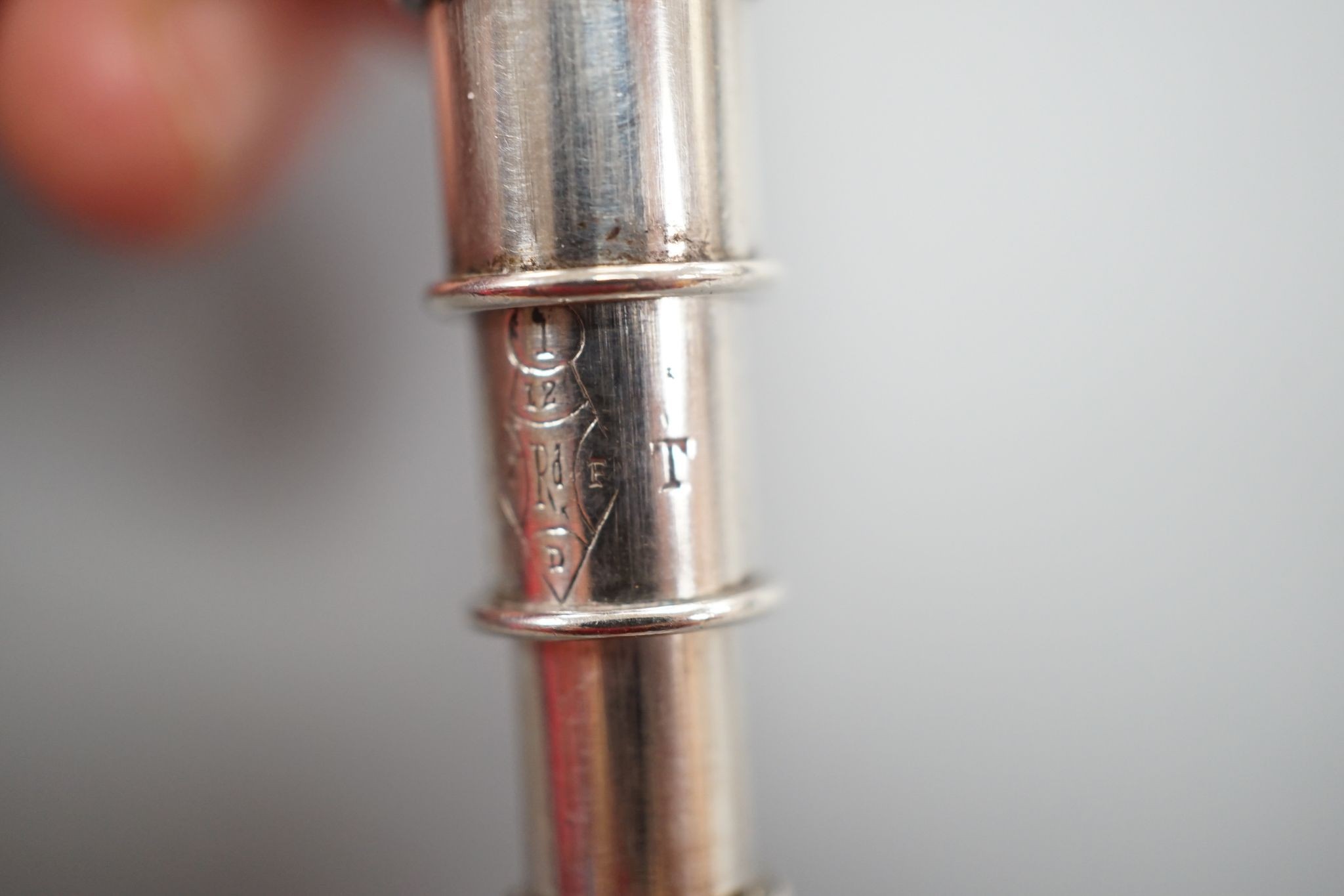Sampson Mordan novelty plated telescopic pencil, in the form of a spinning top when closed, 9 cms long.